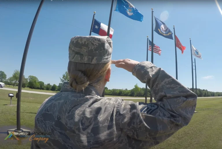 National guard service member in uniform saluting a row of flags, from a #Roof4Braves campaign