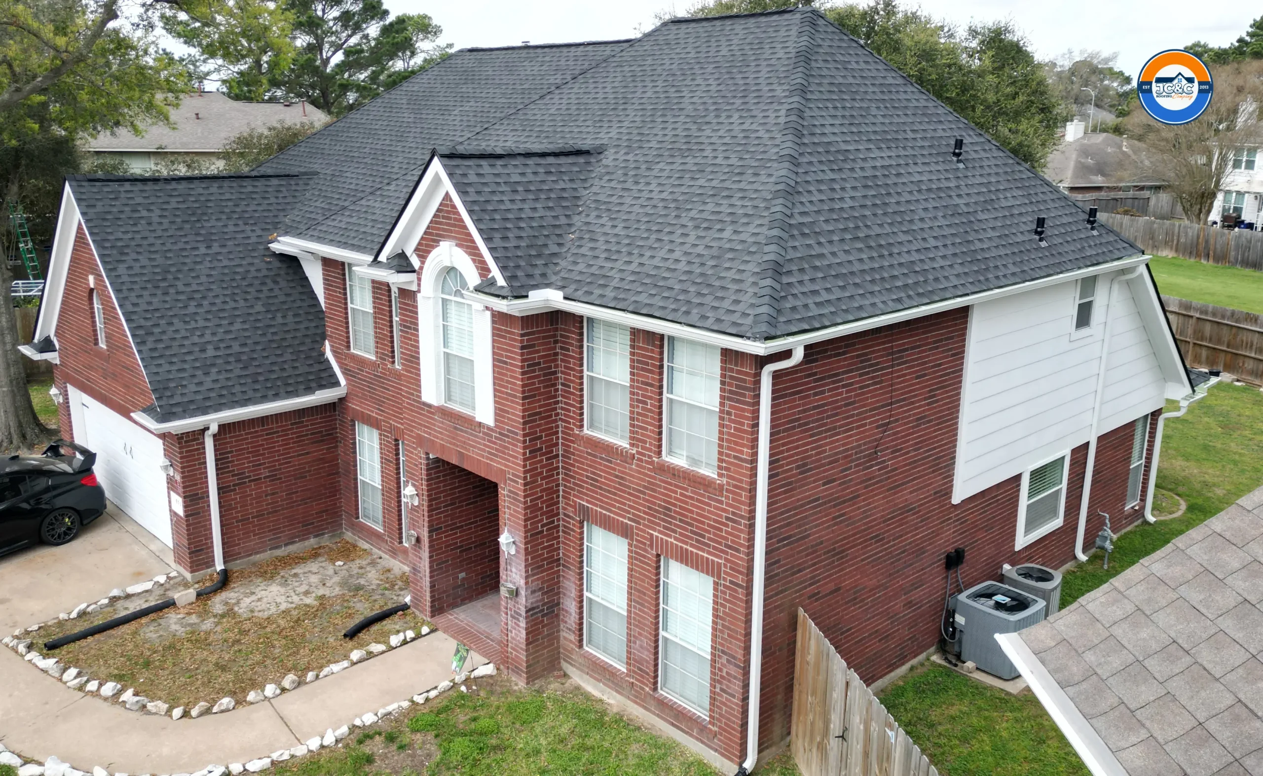 Beautiful new James Hardie siding and 6 gutters installation by JC&C Roofing Company