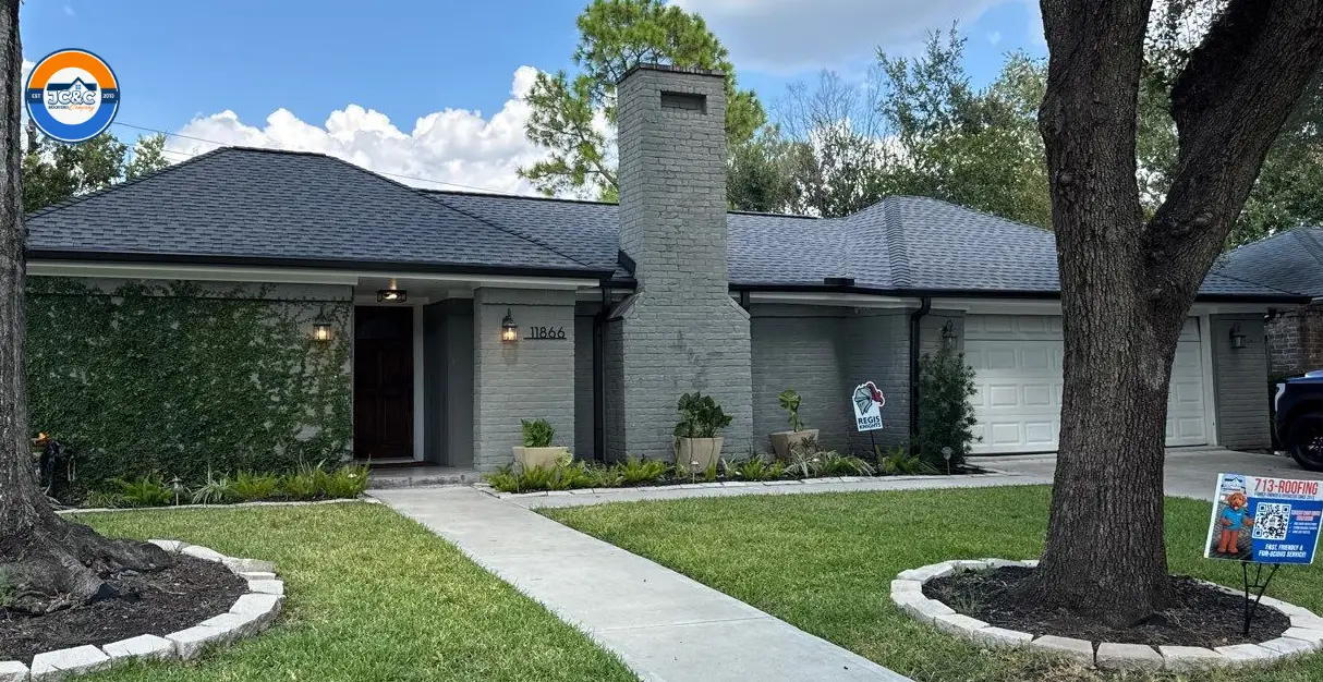 Beautiful home with new siding, gutters, and roof by JC&C Roofing Company